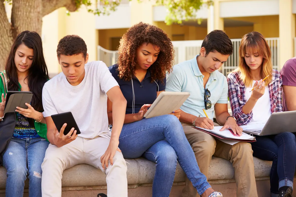 Students completing online driver education on devices